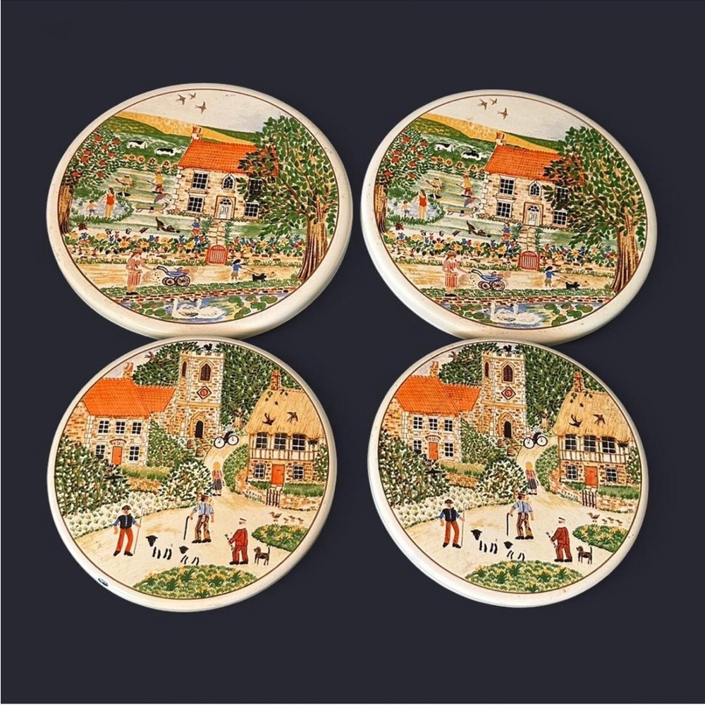Vintage enamel stove burner covers, maybe Prinknash Pottery village collection
